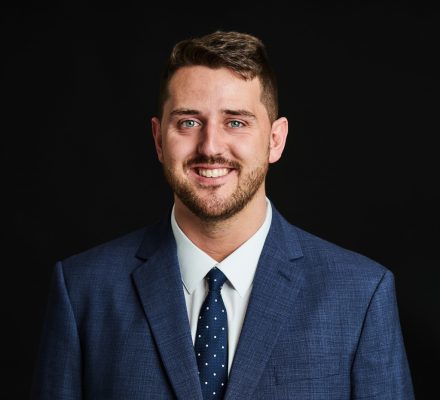 Headshot of Ryan Mansell, Head of Electrical and Electronics, smiling at the camera.